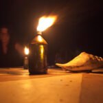 Single candle burning in the dark — a memorial tribute image for Ken Urker (CC BY 4.0: Vyacheslav Argenberg via Wikimedia Commons)