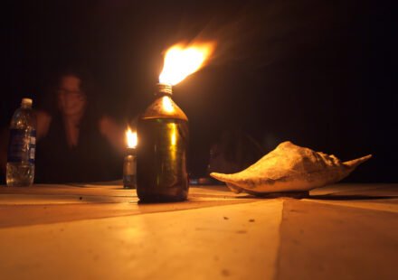 Single candle burning in the dark — a memorial tribute image for Ken Urker (CC BY 4.0: Vyacheslav Argenberg via Wikimedia Commons)