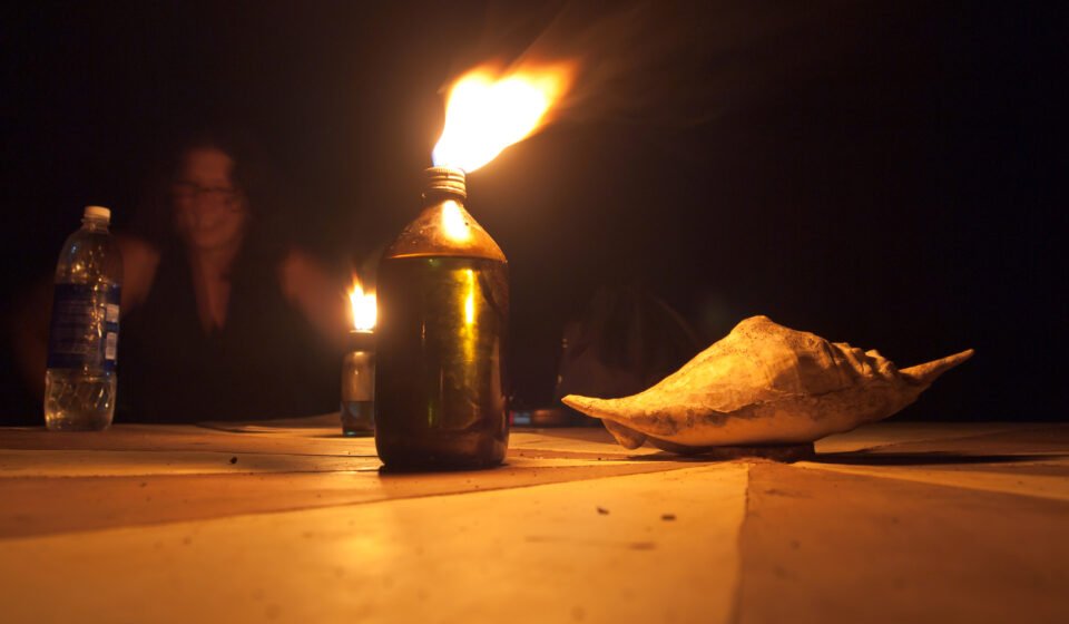 Single candle burning in the dark — a memorial tribute image for Ken Urker (CC BY 4.0: Vyacheslav Argenberg via Wikimedia Commons)