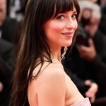 Dakota Johnson on the red carpet at the 2025 Cannes Film Festival premiere of "Highest 2 Lowest"