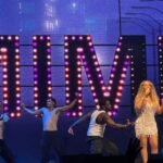 Mariah Carey performing on stage; her songs inspired this week's Dancing with the Stars theme night