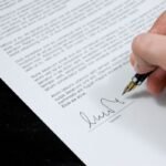 Hand signing a petition document with a fountain pen — illustration for Gypsy Rose Blanchard's anti-cyberbullying petition