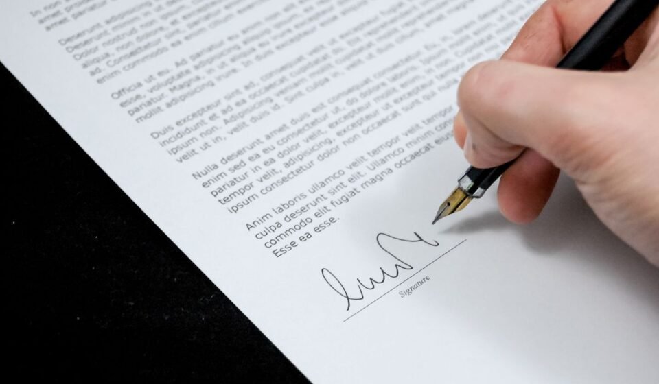 Hand signing a petition document with a fountain pen — illustration for Gypsy Rose Blanchard's anti-cyberbullying petition