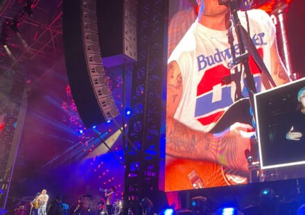 Zach Bryan performing on stage during a concert